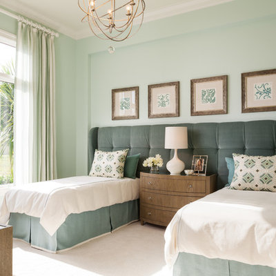 Example of a transitional guest carpeted and beige floor bedroom design in Miami with green walls