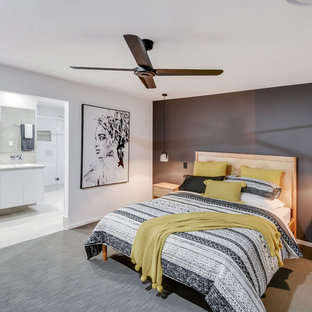 Large scandinavian master bedroom in Sunshine Coast with white walls, carpet and grey floor.