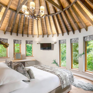 Inspiration for a medium sized rustic bedroom in Cambridgeshire with white walls, light hardwood flooring and beige floors.