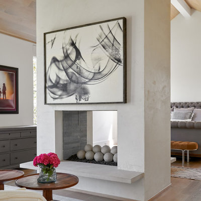 Bedroom - mid-sized transitional master medium tone wood floor and brown floor bedroom idea in Dallas with white walls, a two-sided fireplace and a tile fireplace
