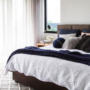 Design ideas for a contemporary master bedroom in Melbourne with white walls.
