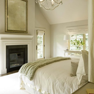 Transitional bedroom photo in Denver with beige walls and a standard fireplace