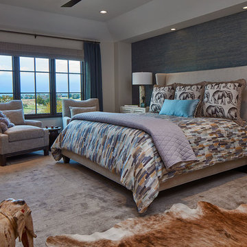 Blue and Beige Bedroom with Cow Hide Rug and Elephant Accents