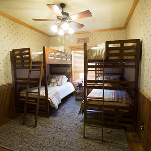 This is an example of a mid-sized traditional guest bedroom in Dallas with yellow walls, concrete floors and no fireplace.