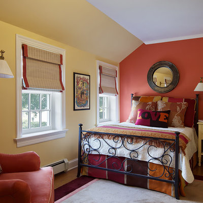 Mid-sized elegant guest light wood floor and beige floor bedroom photo in New York with red walls and no fireplace