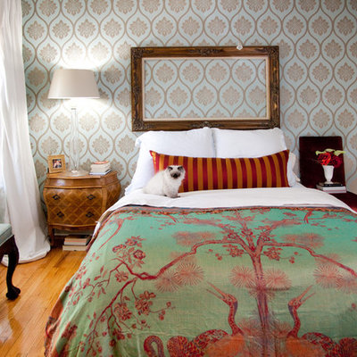 Eclectic medium tone wood floor bedroom photo in Chicago with multicolored walls
