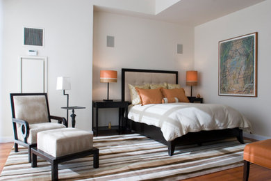 Inspiration for a mid-sized modern guest medium tone wood floor bedroom remodel in Boston with white walls