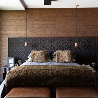 Photo of a contemporary bedroom in Sydney with brown walls, carpet and grey floor.