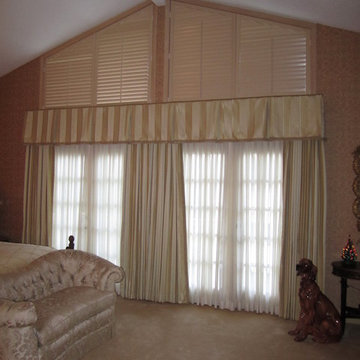 Box Pleated Valance over Full Closure Draperies & Sheers; Shutters on Trapezoid