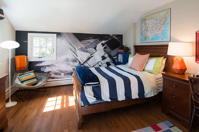 Example of an eclectic medium tone wood floor bedroom design in Philadelphia with multicolored walls