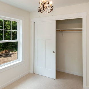 Mid-sized elegant master carpeted and beige floor bedroom photo in Seattle with white walls and no fireplace