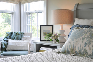 Example of a mid-sized beach style guest carpeted and gray floor bedroom design in Boston with beige walls and no fireplace