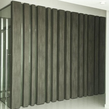 Brickell private condo - Custom columns wrapped with wood architectural film.