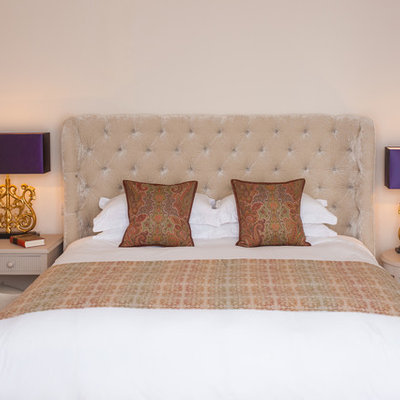 Bedroom - traditional master carpeted bedroom idea in Sussex with beige walls