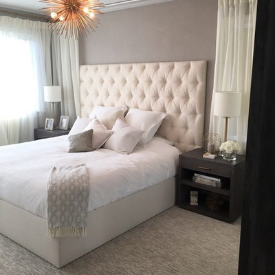 Example of a mid-sized transitional guest carpeted bedroom design in New York with gray walls and no fireplace