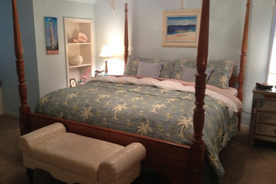 Example of a mid-sized arts and crafts guest carpeted bedroom design in Other with blue walls