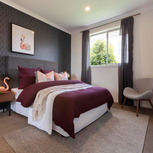This is an example of a contemporary guest bedroom in Melbourne with beige walls, carpet, no fireplace, brown floor and wallpaper.