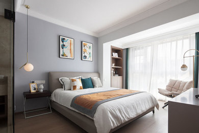Design ideas for a large contemporary master bedroom in London with purple walls, laminate floors and yellow floors.