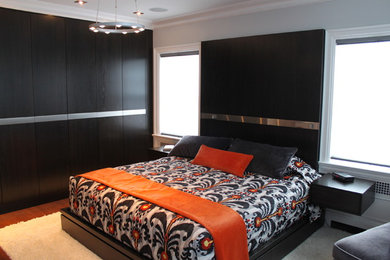 Bedroom - large contemporary master medium tone wood floor bedroom idea in Toronto with gray walls