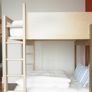 Bunk bed detail in kids room with climbable rock wall