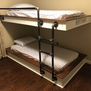 Bunk beds with black steel pipe stairs