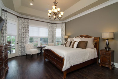 Mid-sized elegant master dark wood floor and brown floor bedroom photo in Nashville with brown walls and no fireplace