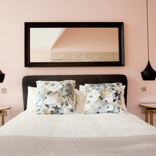 Transitional master bedroom photo in Surrey with pink walls