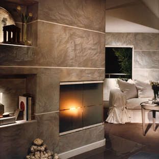 Imagen de dormitorio principal, minimalista, grande, con paredes grises, suelo de linóleo, chimenea de esquina y marco de chimenea de baldosas y/o azulejos