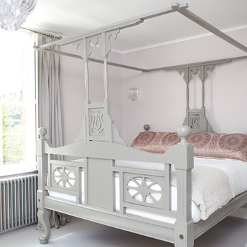 Calm and romantic bedroom with Victorian canopy bed