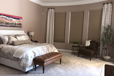 Small classic master bedroom in Phoenix with beige walls, carpet and beige floors.