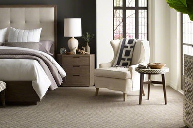 Example of a large classic master carpeted and beige floor bedroom design in Omaha with gray walls