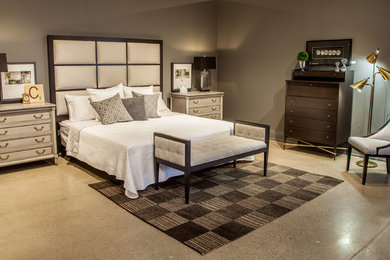 Example of a mid-sized trendy master concrete floor and beige floor bedroom design in Toronto with gray walls and no fireplace