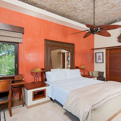 Inspiration for a mediterranean bedroom remodel in Other with orange walls