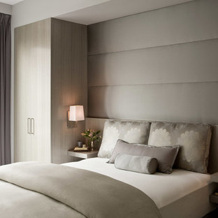 Imagen de habitación de invitados contemporánea, de tamaño medio, con paredes grises y moqueta
