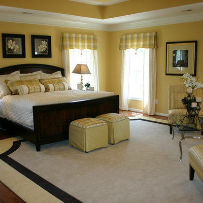 Inspiration for a timeless master dark wood floor bedroom remodel in Baltimore with yellow walls and no fireplace