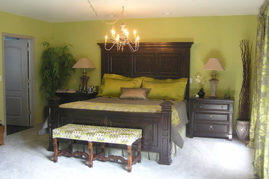 Large traditional master bedroom in Philadelphia with carpet, a corner fireplace, green walls, a metal fireplace surround and grey floors.