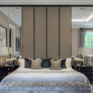 Traditional master bedroom in Berkshire with beige walls, carpet and beige floors.
