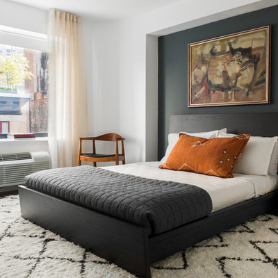 Inspiration for a contemporary bedroom remodel in Charleston with white walls