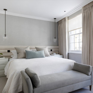 Traditional bedroom in London with grey walls, carpet and grey floors.