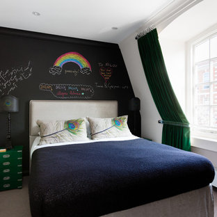 Design ideas for a contemporary guest bedroom in London with black walls and carpet.