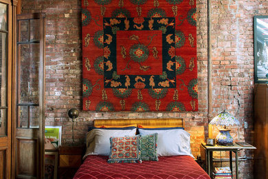 Bedroom - eclectic medium tone wood floor bedroom idea in New York