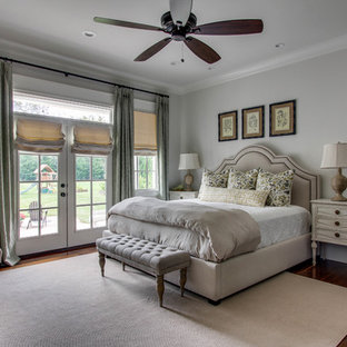 Inspiration for a mid-sized timeless master medium tone wood floor bedroom remodel in Nashville with gray walls and no fireplace