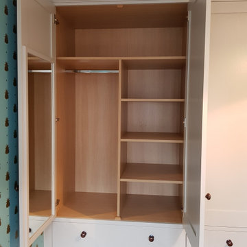 Child's bedroom wardrobe interior with fitted mirror