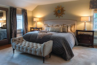 Inspiration for a large transitional master laminate floor and brown floor bedroom remodel in New York with beige walls