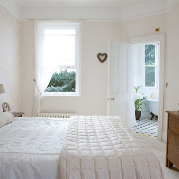 Classic master bedroom with sash window and high ceilings