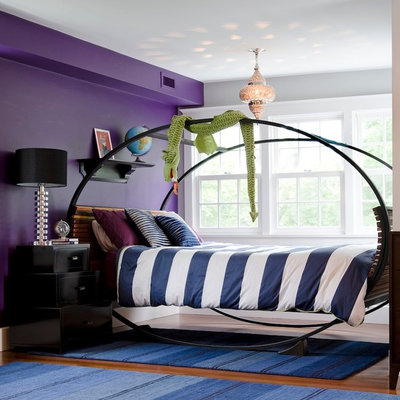 Example of a large eclectic dark wood floor bedroom design in Boston with purple walls and no fireplace