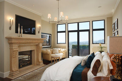 Transitional dark wood floor bedroom photo in San Francisco with beige walls, a standard fireplace and a stone fireplace