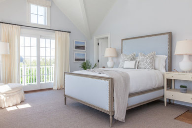 Large beach style master carpeted and beige floor bedroom photo in Boston with blue walls and no fireplace