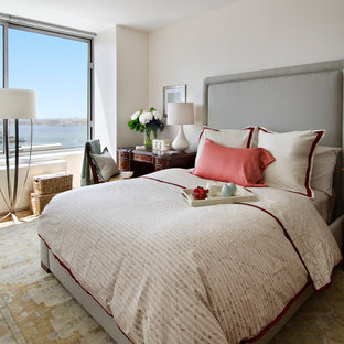 Example of a mid-sized classic master light wood floor bedroom design in Miami with beige walls