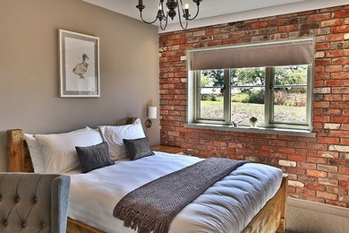 Inspiration for a medium sized country guest bedroom in Cheshire with multi-coloured walls, carpet and no fireplace.